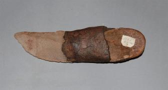 Knife made of stone and wood handle