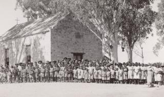 Growing congregation in front of the church